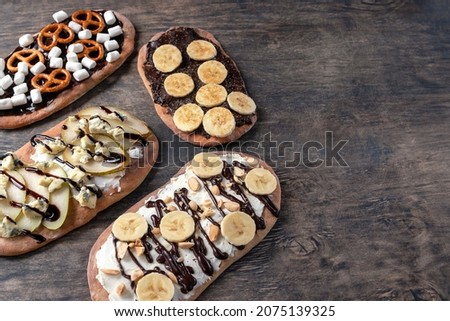 Dessert with the original name "Beaver Tails" comes with different fillings. Also, this dessert is called the tail of beauty, as it is often decorated with various icing sprinkles. Royalty-Free Stock Photo #2075139325