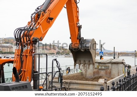 Picture of an excavators machine in construction site 