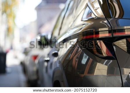 Close up picture of shiny modern car in the parking space in Budapest downtown