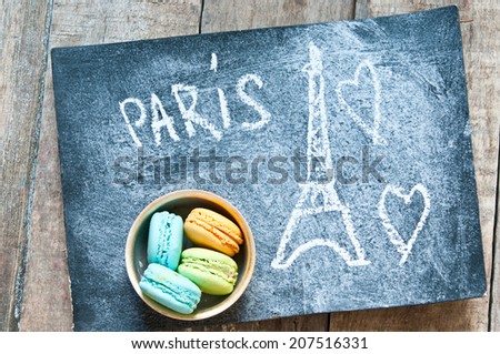 Sweet and colorful french macaroons on retro-vintage background