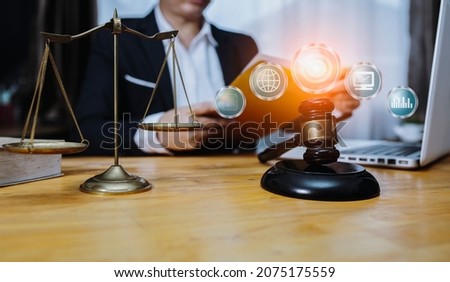 Lawyer hands working with digital laptop computer on table office. Law innovation network icons, blurred background.