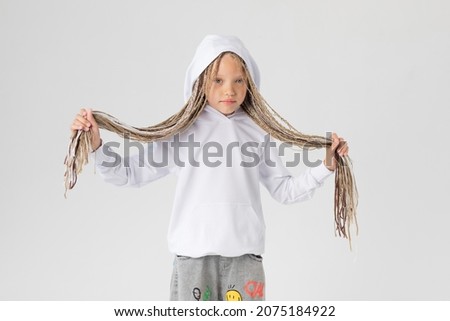 Beautiful girl with long afrokos in a white hoodie. Mock-up.