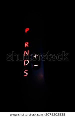 Night illumination of automatic transmission modes in the car. Red glowing symbols of automatic transmission.