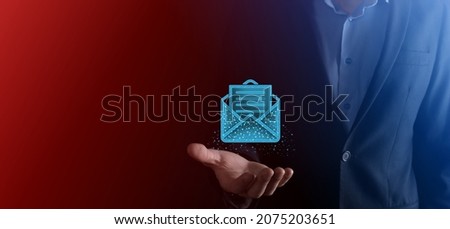 Businessman hand holding letter icon,email icons.Contact us by newsletter email and protect your personal information from spam mail.Customer service call center contact us.Email marketing newsletter