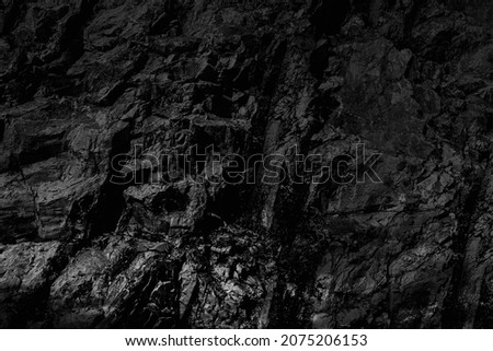 Grungy cragged bumpy pitted cavity stone facade, split layer gap.Ruined cracked shattered worn rough hiking canyon.Old ragged grunge steep marble cliff. Grand vintage crannied damaged impressive gorge Royalty-Free Stock Photo #2075206153
