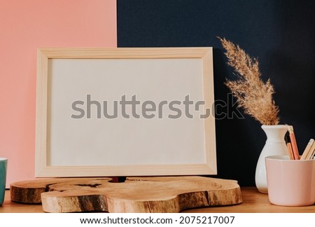 Pink and dark blue background and empty frame