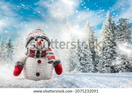cute snowman in snowy winter landscape with firs
