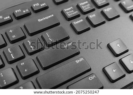 Black keyboard keys closeup. Macro shot of Enter keyboard button, pc hotkey, keystroke photo