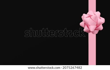 Present. Template for posters and banners with copy space. Pink pastel lush bow on black background. Top view