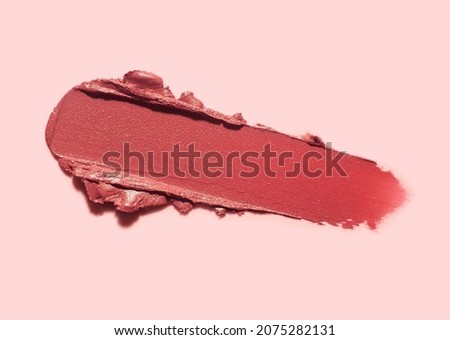 Lipstick or blusher abstract strokes smudges  background texture multi colored red blush isolated on white background