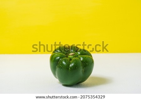 Sweet green pepper for healthy on yellow white background. Healthy food and vegan concept Whitespace