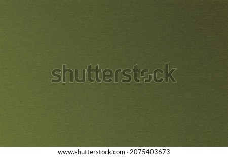 The texture of the dark olive velvet. The background of dark olive cloth. Luxury background of dark olive velvet. Military Green
