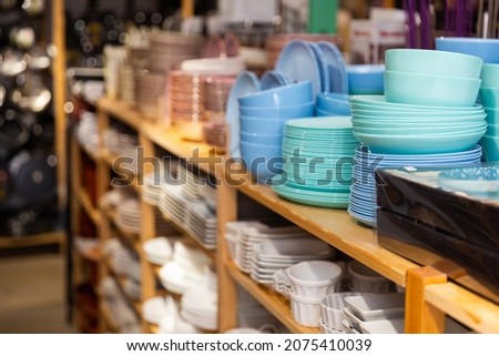 Closeup of variety dishes, bowls and other goods for kitchen at a decor store Royalty-Free Stock Photo #2075410039