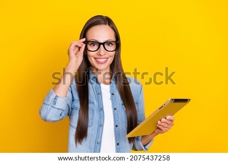 Photo of young charming lady use gadget tablet representative agent isolated over yellow color background