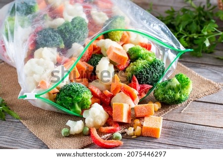 Frozen vegetables in plastic bags on a table. Frozen food Royalty-Free Stock Photo #2075446297