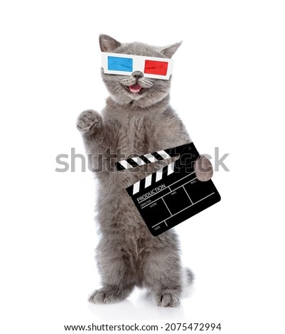 Happy kitten holds clapper board for making video cinema. Movie production clapper board or slate film concept. isolated on white background