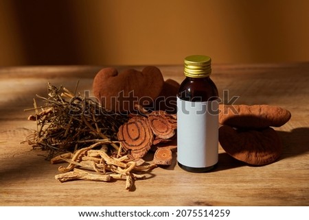 Traditional chinese medicine with herb and spices in brown wooden background and medicine jar , for medicine advertising , photography traditional medicine content