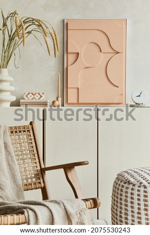 Creative composition of modern beige living room interior design with mock up structure painting, beige wooden sideboard, armchair and boho inspired personal accessories. Template.