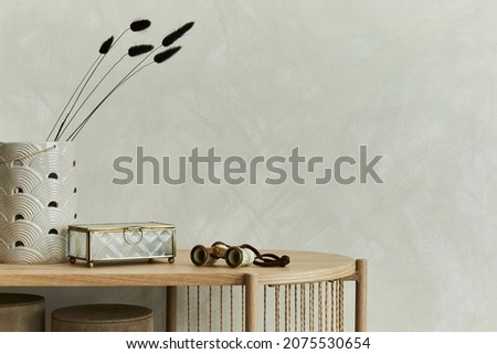 Minimalitic composition of living room interior design with vase, box and personal accessories on the wooden console. Copy space. Template.