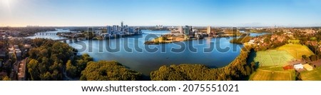 Sydney city CBD to Parramatta CBD wide aerial panorama over Parramatta river in Meadowbank. Royalty-Free Stock Photo #2075551021