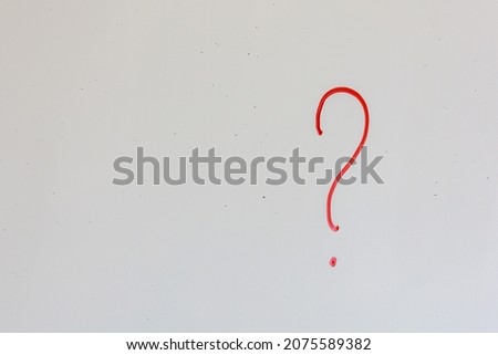 Question mark on an old white magnetic board in the office. Background with copy space for text or lettering
