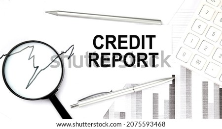 CREDIT REPORT document with pen,graph and magnifier,calculator,business