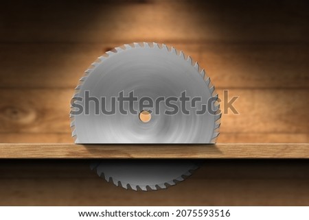 Closeup of a metal circular saw blade that cutting a plank of wood. Carpentry concept Royalty-Free Stock Photo #2075593516