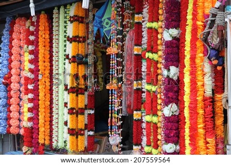 Colorful necklaces hanging on display at a street stall in George Town, Malaysia. Royalty-Free Stock Photo #207559564
