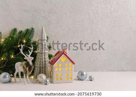 Christmas composition of Christmas decorations, garland, candle, deer and  copy space for text. Template.