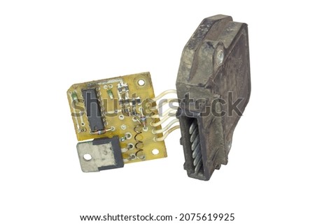 electronic ignition control module with pin blade terminal. main electronic board with hall sensor and its plastic cover. isolated on white background Royalty-Free Stock Photo #2075619925