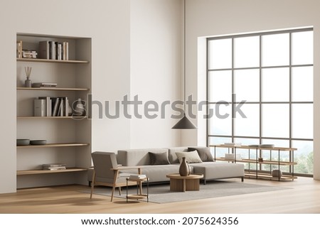 Bright living room interior with large sofa, armchair, panoramic window, bookshelves, carpet and oak wooden floor. Concept of minimalist design. Comfortable place for meeting. 3d rendering Royalty-Free Stock Photo #2075624356
