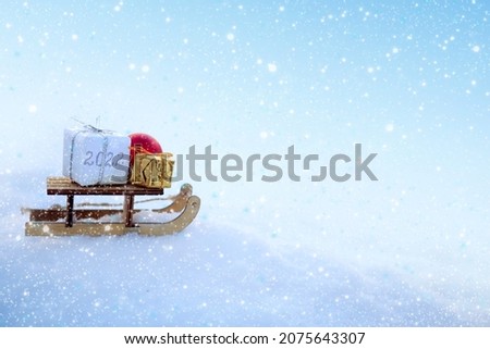 Christmas background with snow and wood sled stand in white snow.