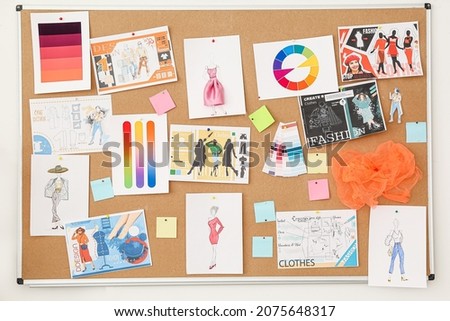 Board with pictures at fashion designer's studio