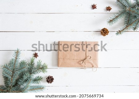 Christmas or New Year background. Fir branches with gift.