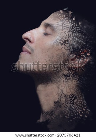 Paintography. Young man dissolving into his thoughts. Isolated on a black background