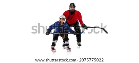 Collage of woman and girl, professional hockey players in uniform with helmet and stick training isolated over white background. Concept of sport, action, motioin, motivation. Copy space for ad