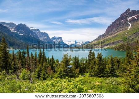 Glacier National Park is a 1,583-sq.-mi. wilderness area in Montana's Rocky Mountains, with glacier-carved peaks and valleys running to the US Canadian border. 