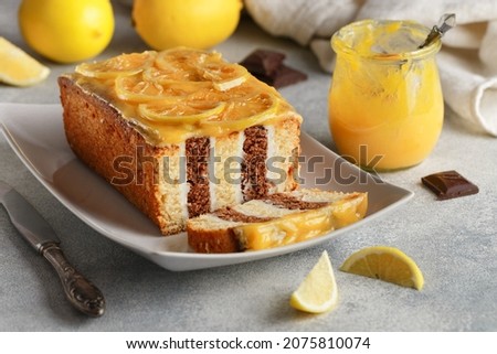 Homemade chocolate cake with cream and lemon curd. Striped Layer cake. year of the tiger. Delicious sweet pastries. Citrus dessert.  Rustic style. Selective focus