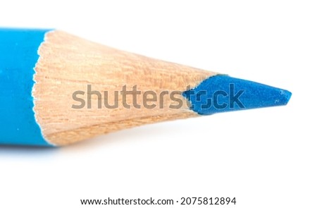 Blue pencil isolated on a white background. Macro
