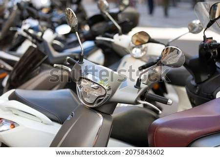 Picture of motorbike, motorcycle scooters parked in city street