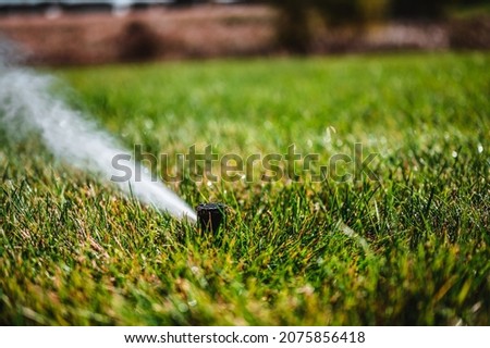 winterizing a irrigation sprinkler system by blowing pressurized air through to clear out water Royalty-Free Stock Photo #2075856418