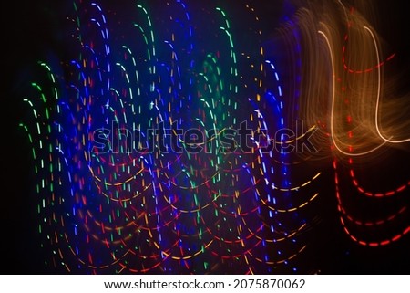 Abstract background of Christmas lights with long exposure.