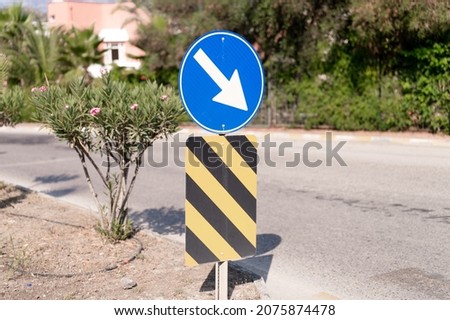 traffic safety signs on city street road. direction movement sign outdoor. danger warning symbol on urban way for transport automobile and car. control and regulate drive in town path