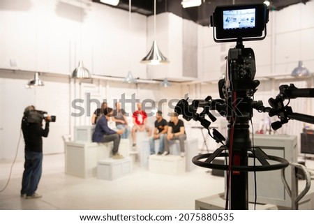 TV Studio, A TV show being filmed in a studio. TV Show Set Royalty-Free Stock Photo #2075880535