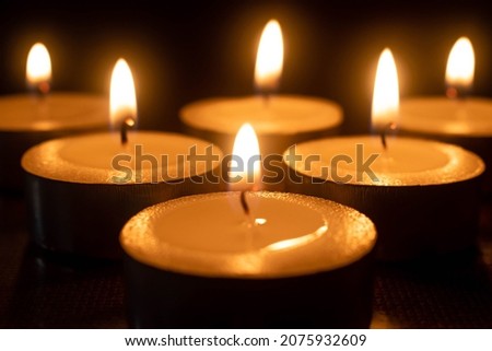 Burning candles. Many burning candles with shallow depth of field, Christmas candles burning at night.