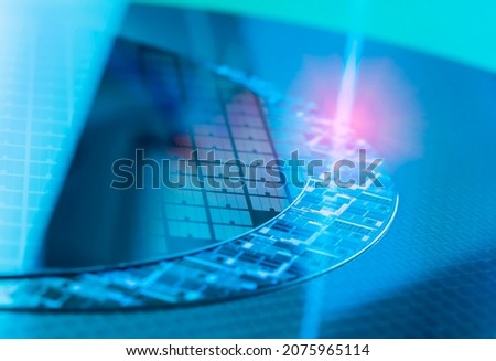 Silicon Wafers with microchips used in electronics for the fabrication of integrated circuits Royalty-Free Stock Photo #2075965114
