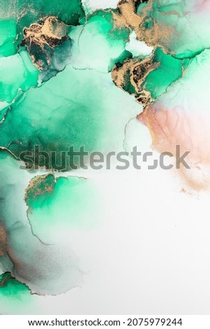 Green gold abstract background of marble liquid ink art painting on paper . Image of original artwork watercolor alcohol ink paint on high quality paper texture . Royalty-Free Stock Photo #2075979244