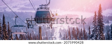 Banner Landscape mountain ski lift resort in winter forest sunset, aerial top view Kemerovo region Russia. Royalty-Free Stock Photo #2075990428