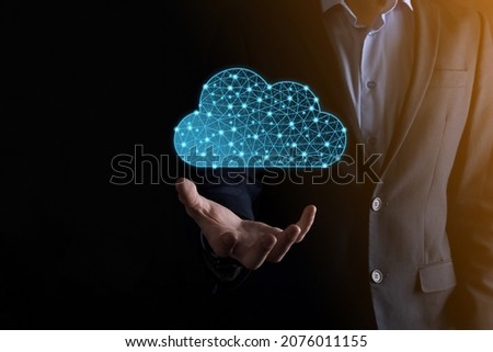 Businessman hold cloud icon.Cloud computing concept - connect smart phone to cloud. computing network information technologist with smart phone.Big data Concept.Low poly,polygonal.