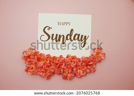 Happy Sunday card typography text with flower bouquet on pink background